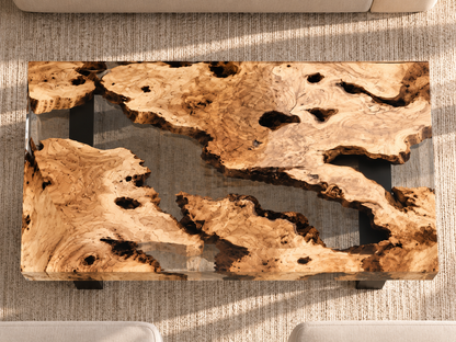 Detail of natural olive wood grain and crystal-clear epoxy resin coffee table — MAGX